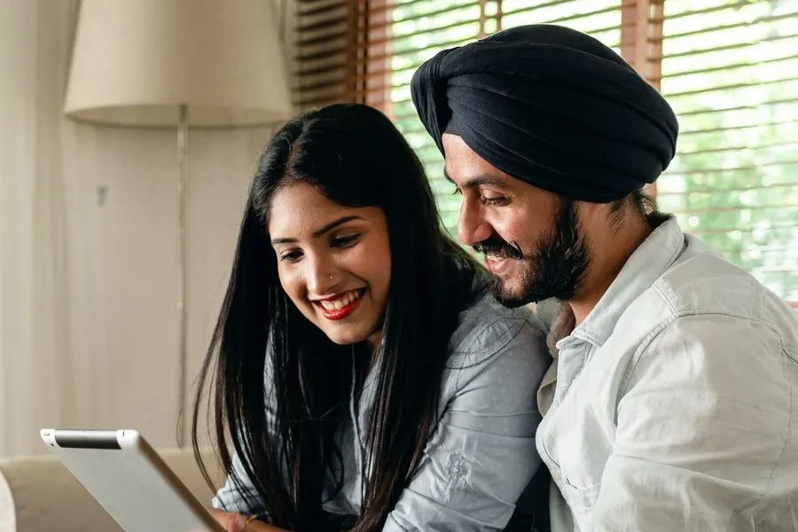 A couple explores something new on a tablet together.